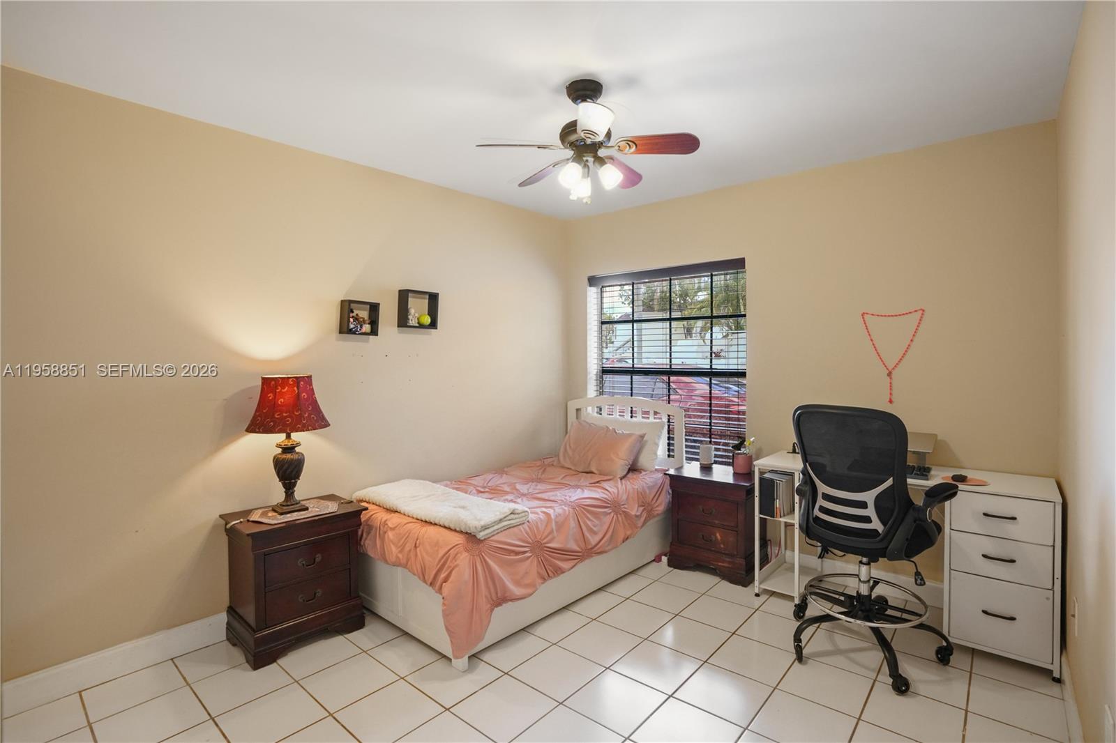 12930 Southwest 88th Terrace, Unit A104 Miami, FL 33186 - Photo 22 of 38 a bedroom with a bed and window