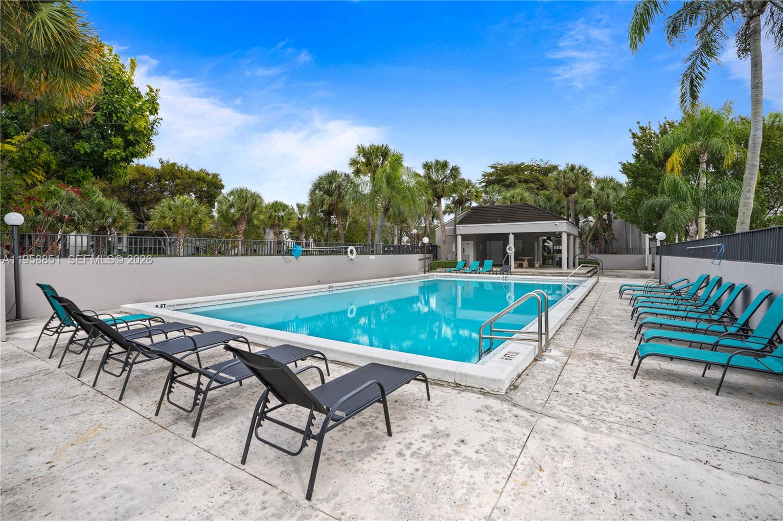 12930 Southwest 88th Terrace, Unit A104 Miami, FL 33186 - Photo 31 of 38 a view of swimming pool with seating space