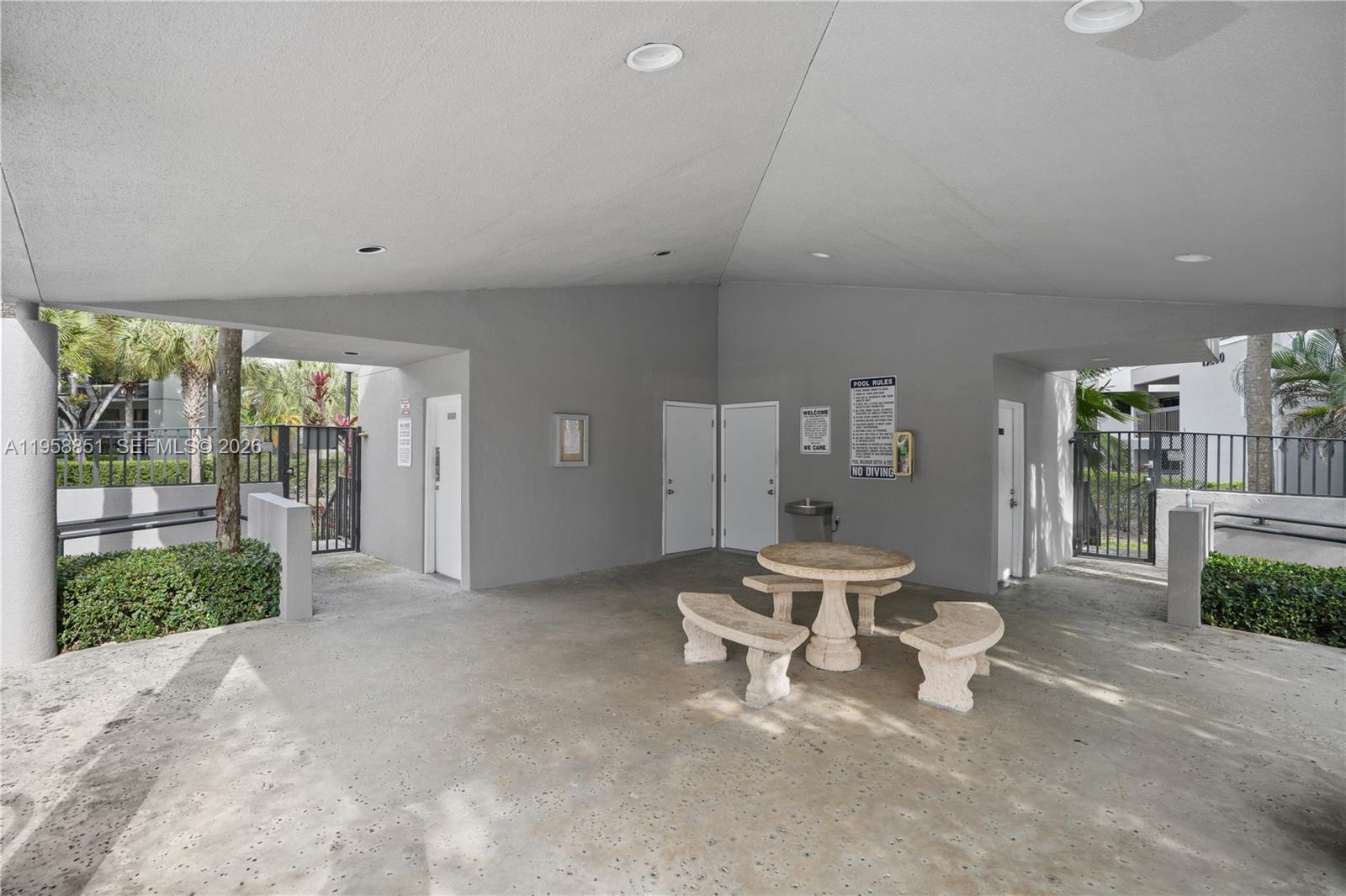 12930 Southwest 88th Terrace, Unit A104 Miami, FL 33186 - Photo 32 of 38 a living room with furniture and a large window