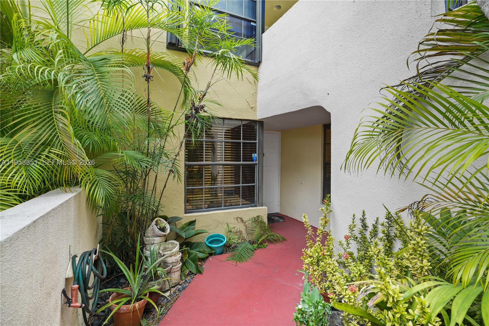 12930 Southwest 88th Terrace, Unit A104 Miami, FL 33186 - Photo 4 of 38 a picture of a yard