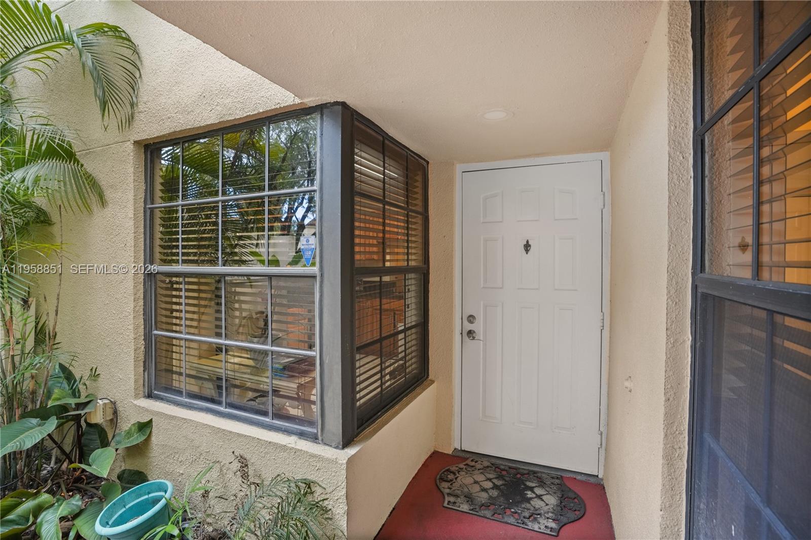 12930 Southwest 88th Terrace, Unit A104 Miami, FL 33186 - Photo 5 of 38 a view of entryway with a rug