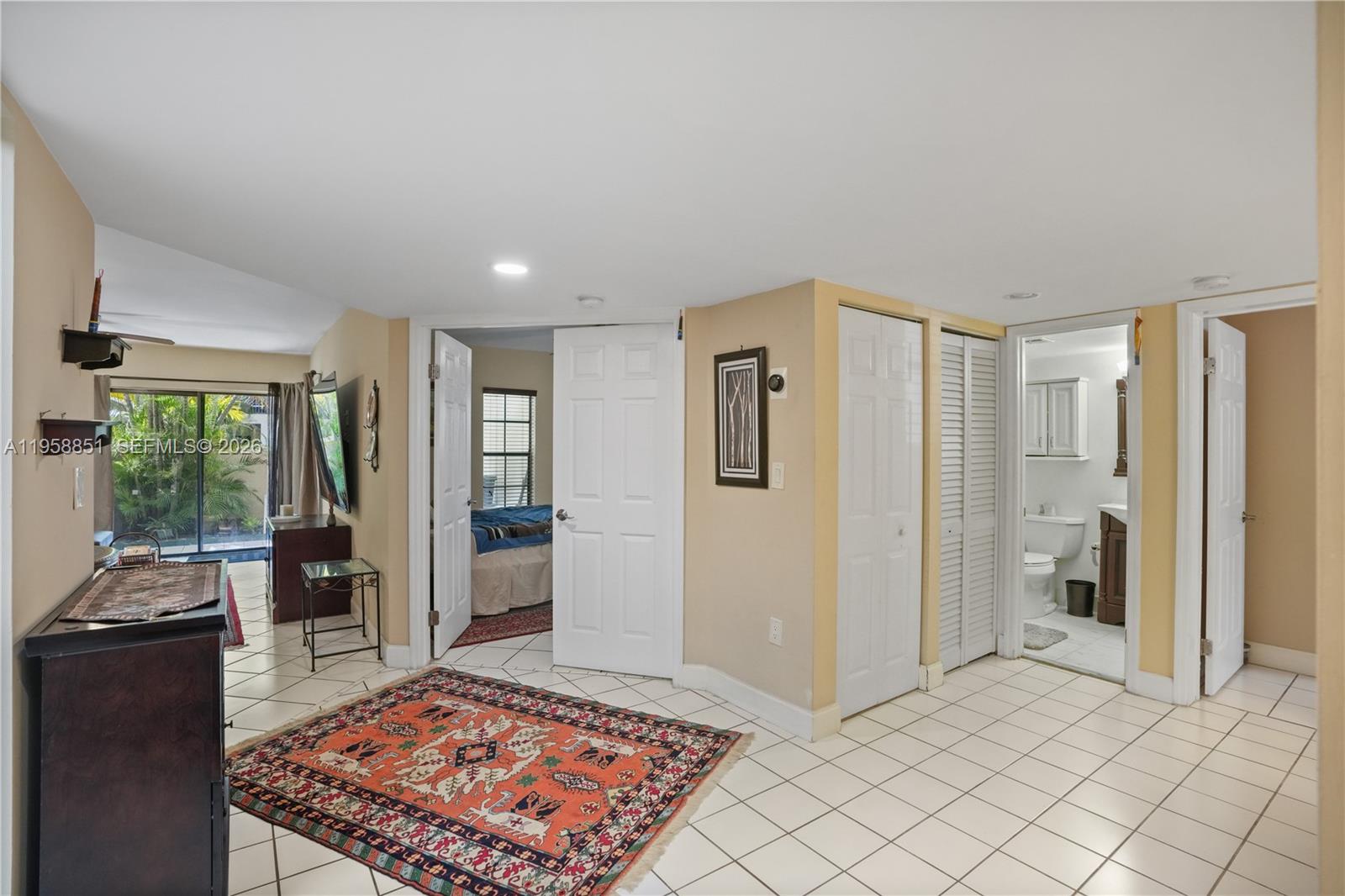 12930 Southwest 88th Terrace, Unit A104 Miami, FL 33186 - Photo 6 of 38 a view of a livingroom with furniture and an entrance
