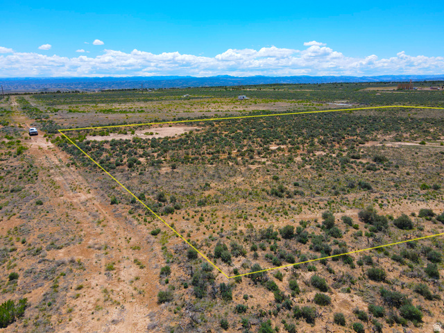 4500 South 22750th Duchesne, UT 84021 - Photo 13 of 34 Expansive undeveloped land with natural vegetation and distant mountain ranges under a clear sky
