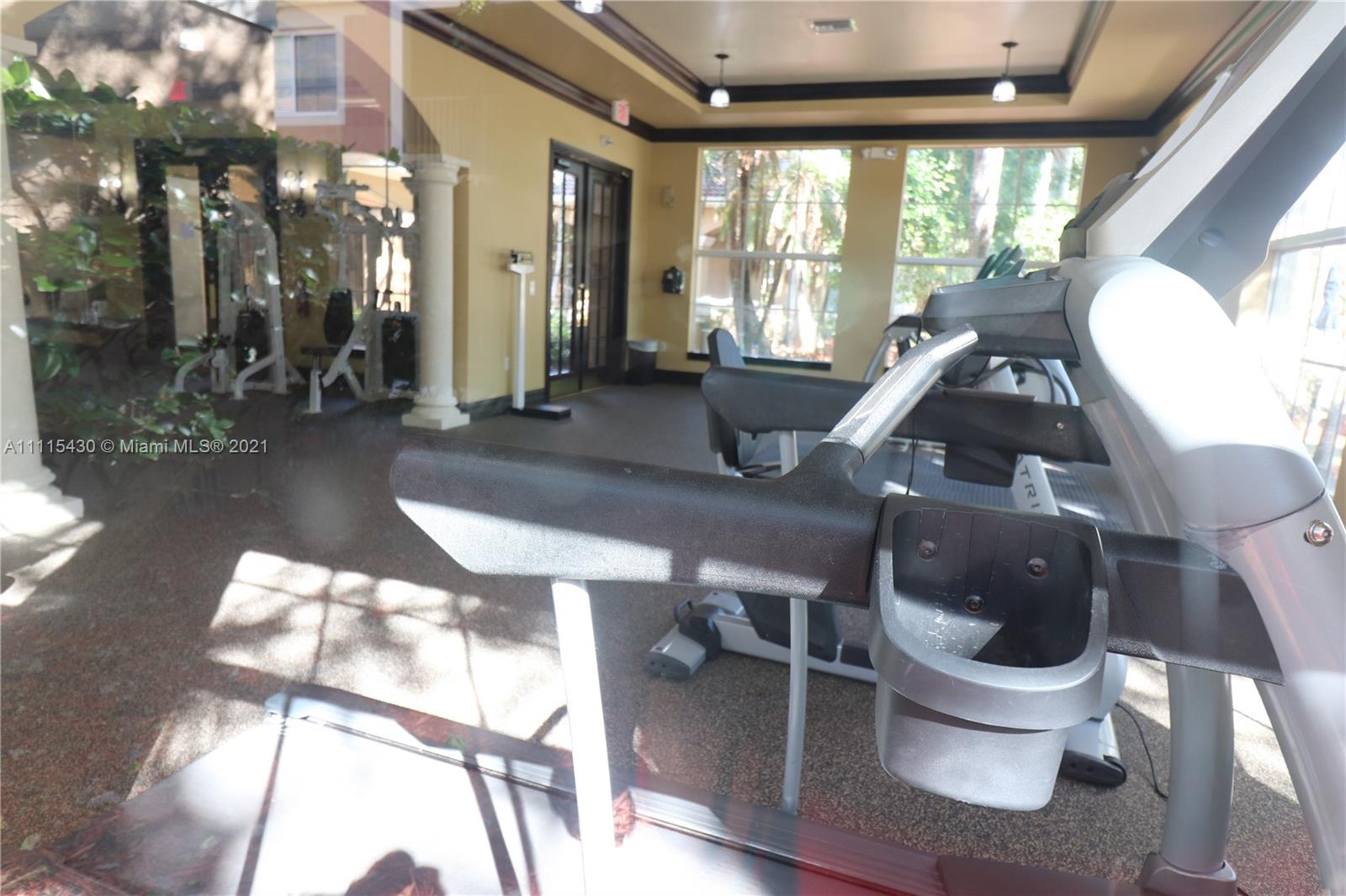 8020 North Nob Hill Road, Unit 208 Tamarac, FL 33321 - Photo 7 of 15 a living room with furniture and a large window