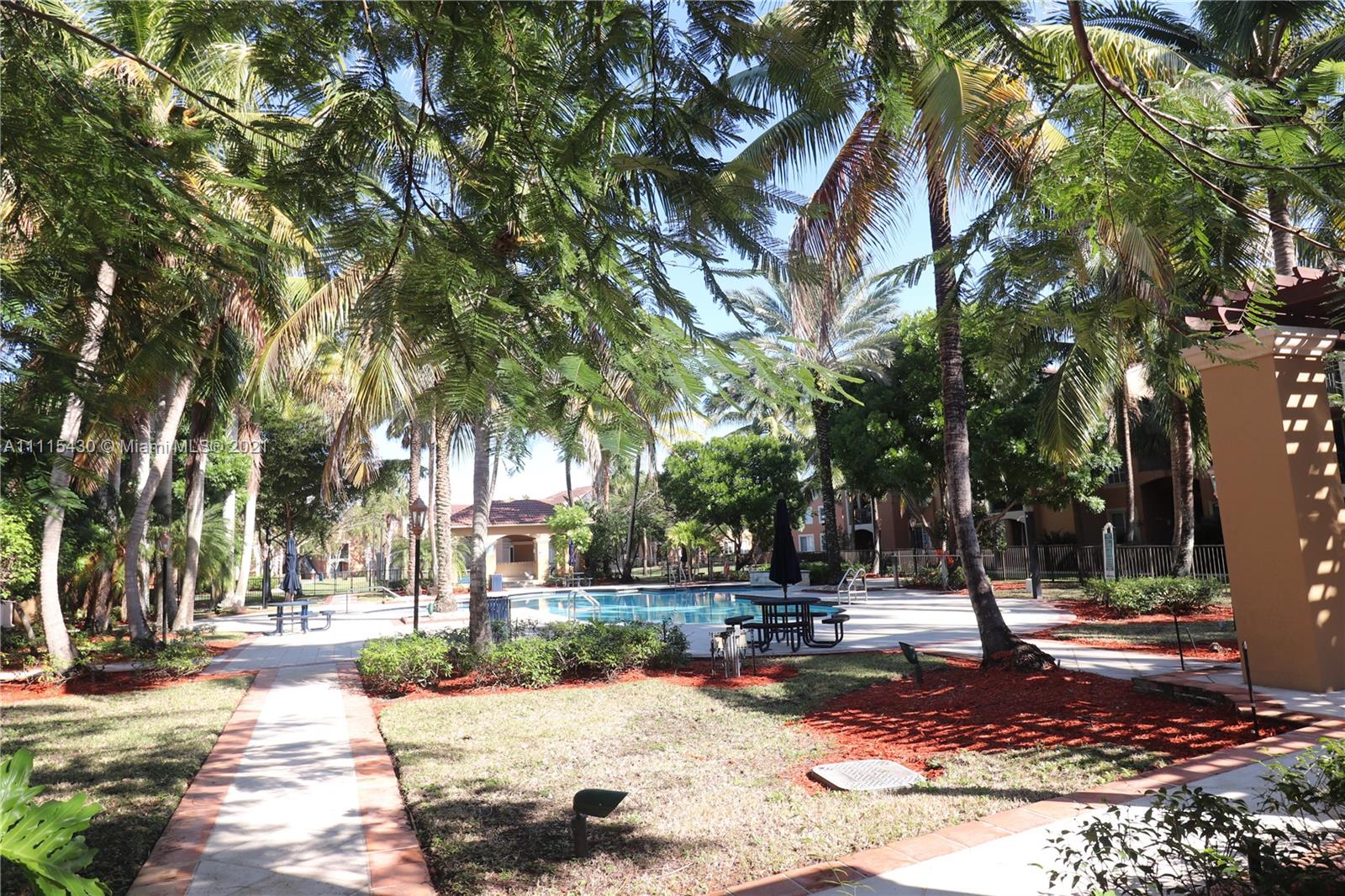 8020 North Nob Hill Road, Unit 208 Tamarac, FL 33321 - Photo 9 of 15 a view of a park with tree s