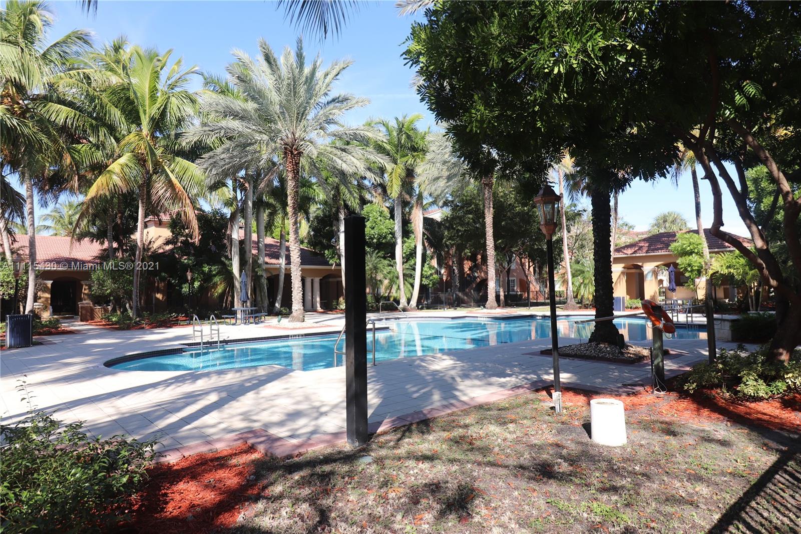 8020 North Nob Hill Road, Unit 208 Tamarac, FL 33321 - Photo 10 of 15 a view of a yard with palm tree