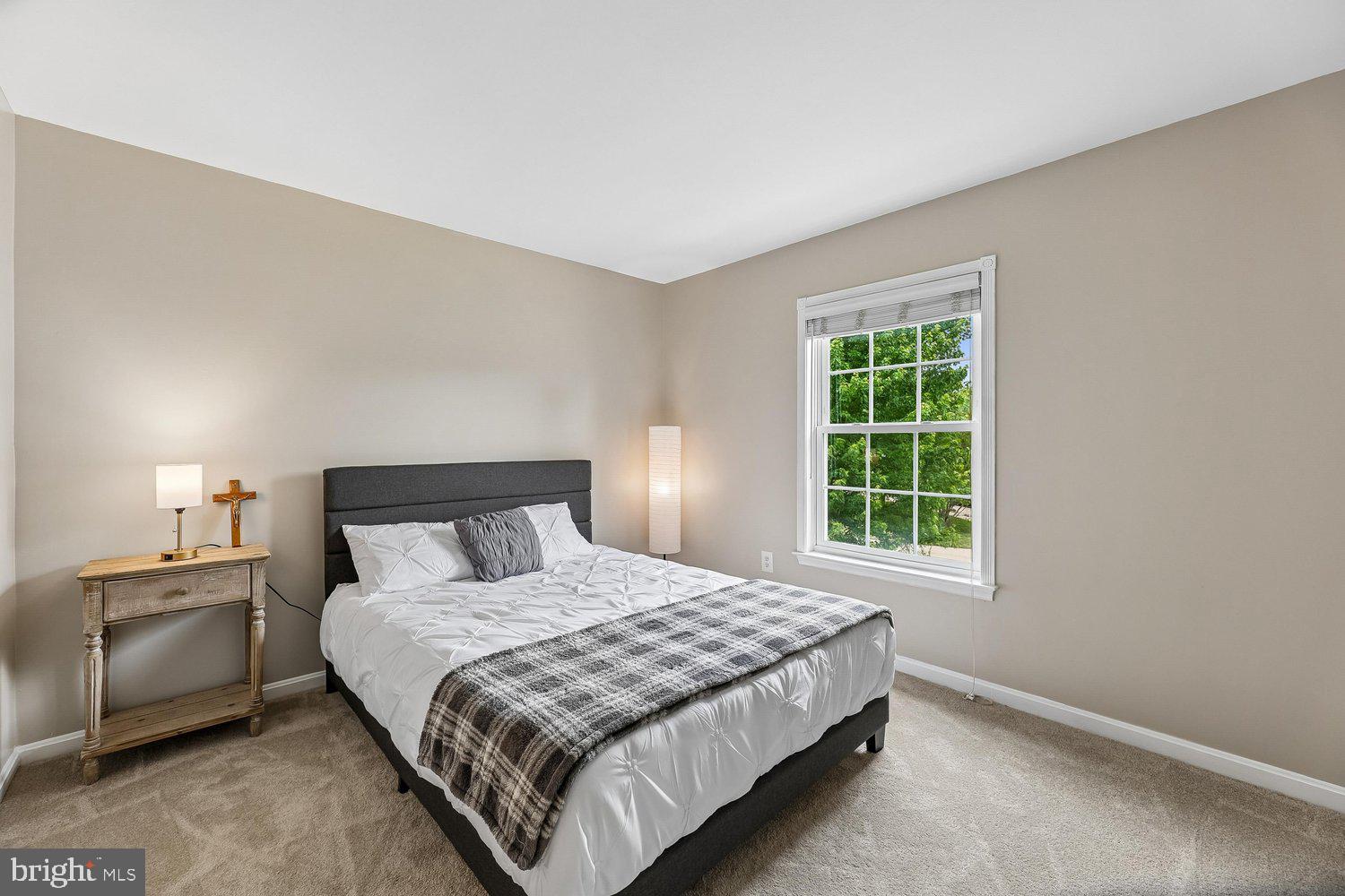 3707 Turn Back Trail Triangle, VA 22172 - Photo 37 of 55 a bedroom with a bed and a window