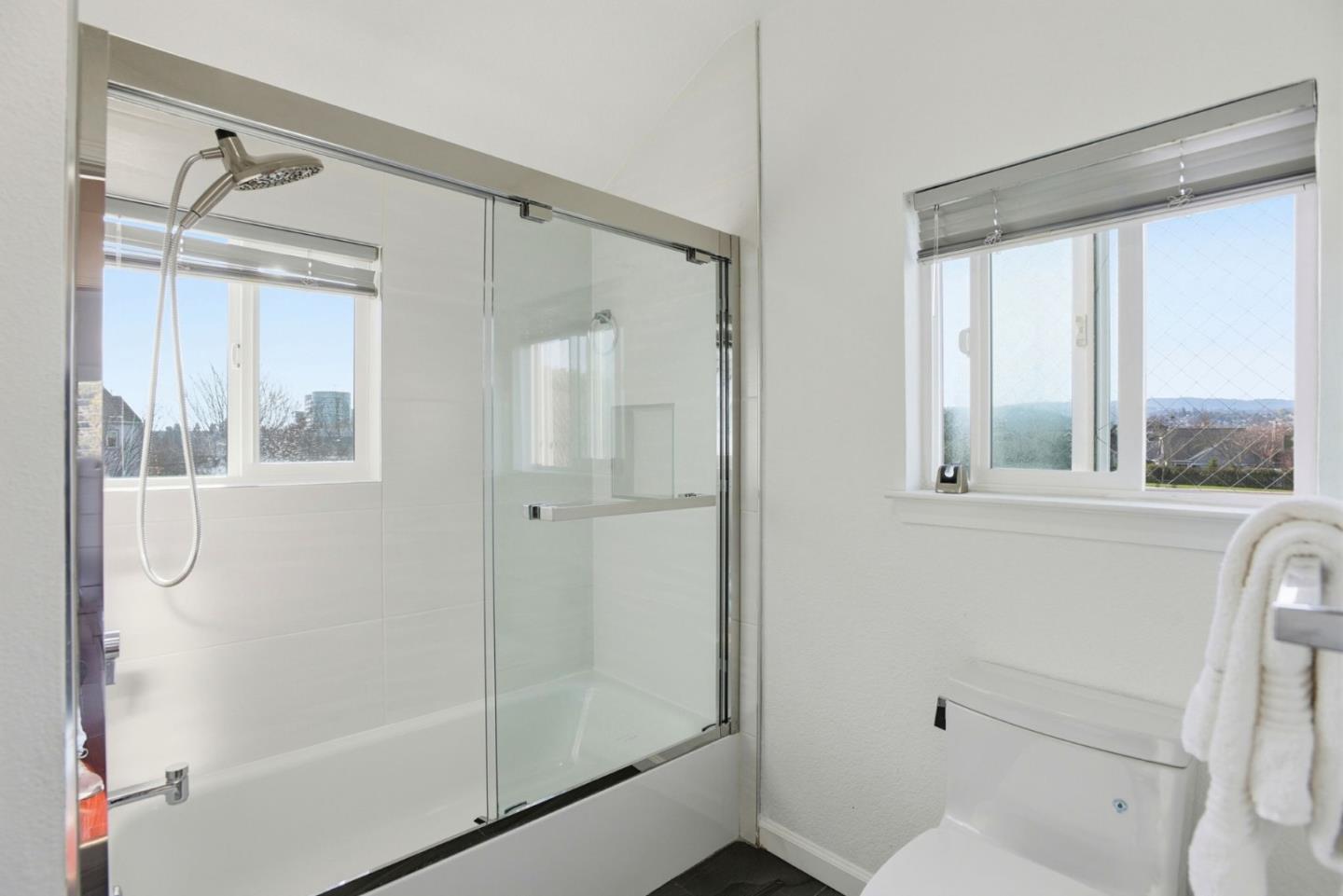 23 Dory Lane Foster City, CA 94404 - Photo 16 of 28 a bathroom with a shower and a window