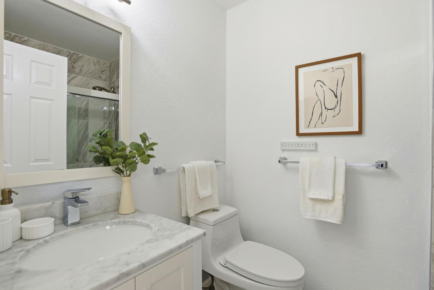 23 Dory Lane Foster City, CA 94404 - Photo 17 of 28 a bathroom with a toilet sink and mirror