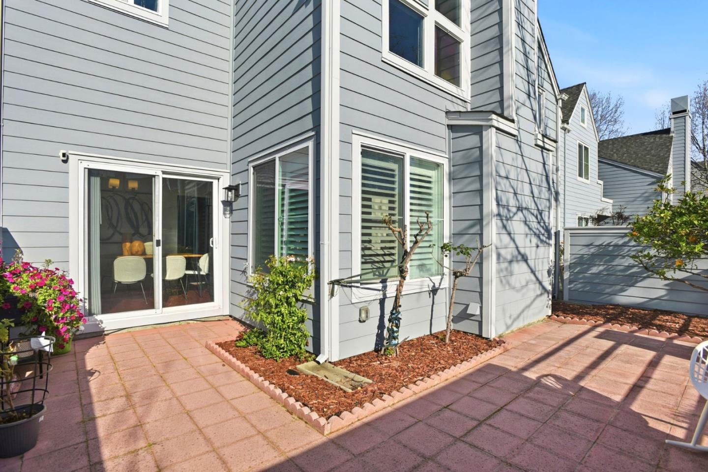 23 Dory Lane Foster City, CA 94404 - Photo 22 of 28 a house with a potted plant in front of it