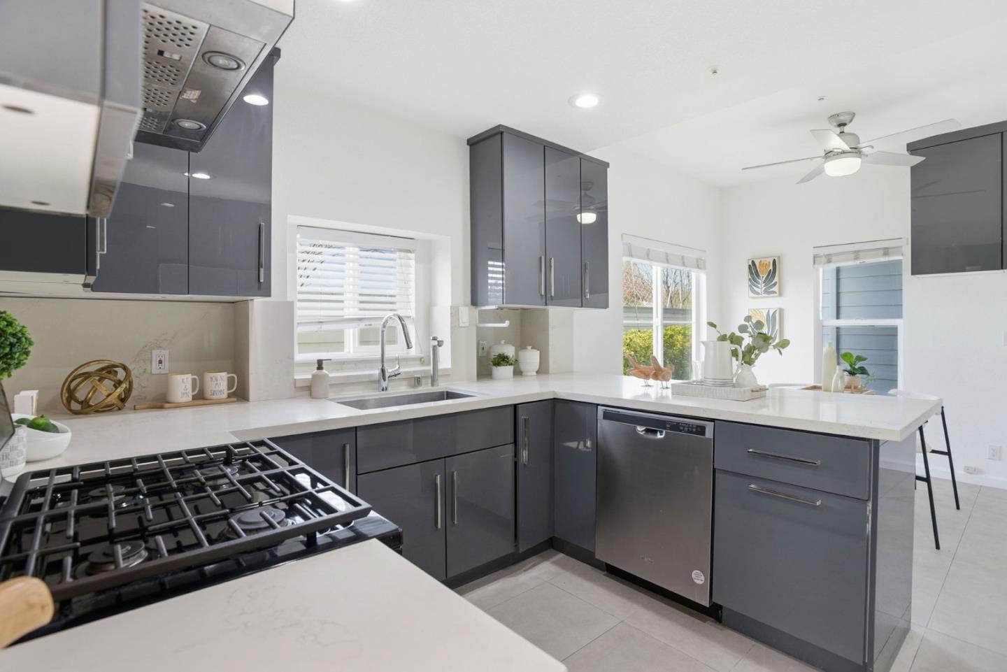 23 Dory Lane Foster City, CA 94404 - Photo 7 of 28 a kitchen with a sink stove and cabinets