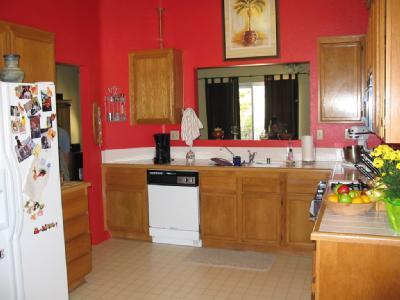3248 Quarry Road Palmdale, CA 93550 - Photo 3 of 6 a view of a kitchen with refrigerator and mirror