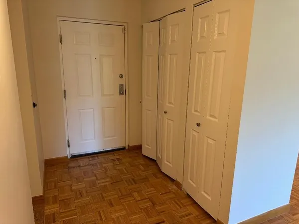 a view of a bathroom with wooden walls