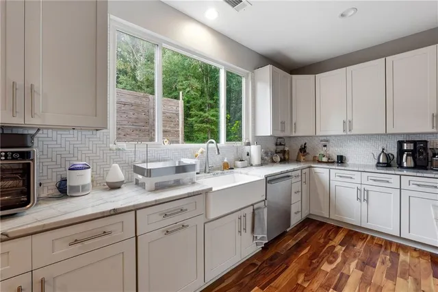 a kitchen with sink cabinets and window