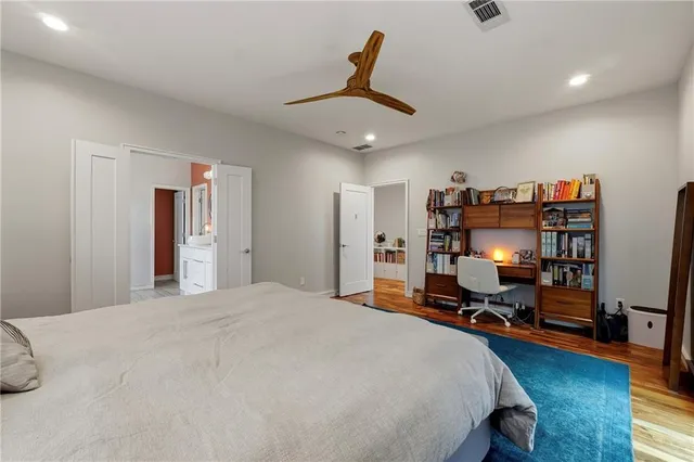 a bedroom with bed and window