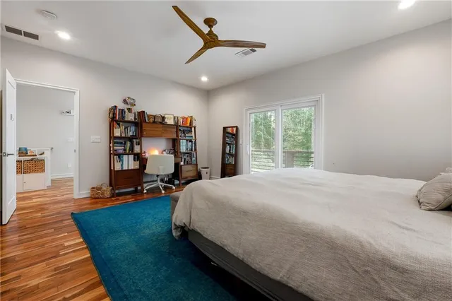 a bed room with a bed and a book shelf