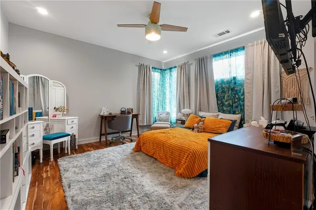 a bedroom with furniture and a window