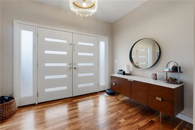 a view of a bathroom with a sink and a mirror