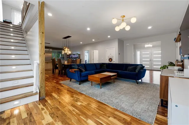 a living room with furniture and kitchen view