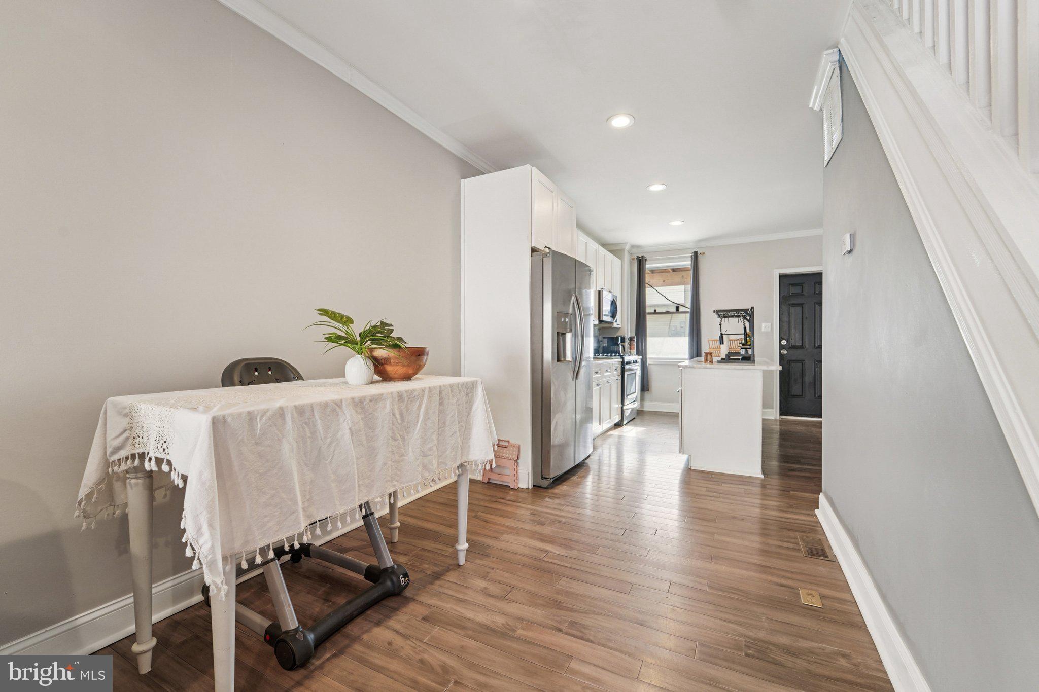 147 North Streeper Street Baltimore, MD 21224 - Photo 13 of 34 a living room with furniture and a wooden floor