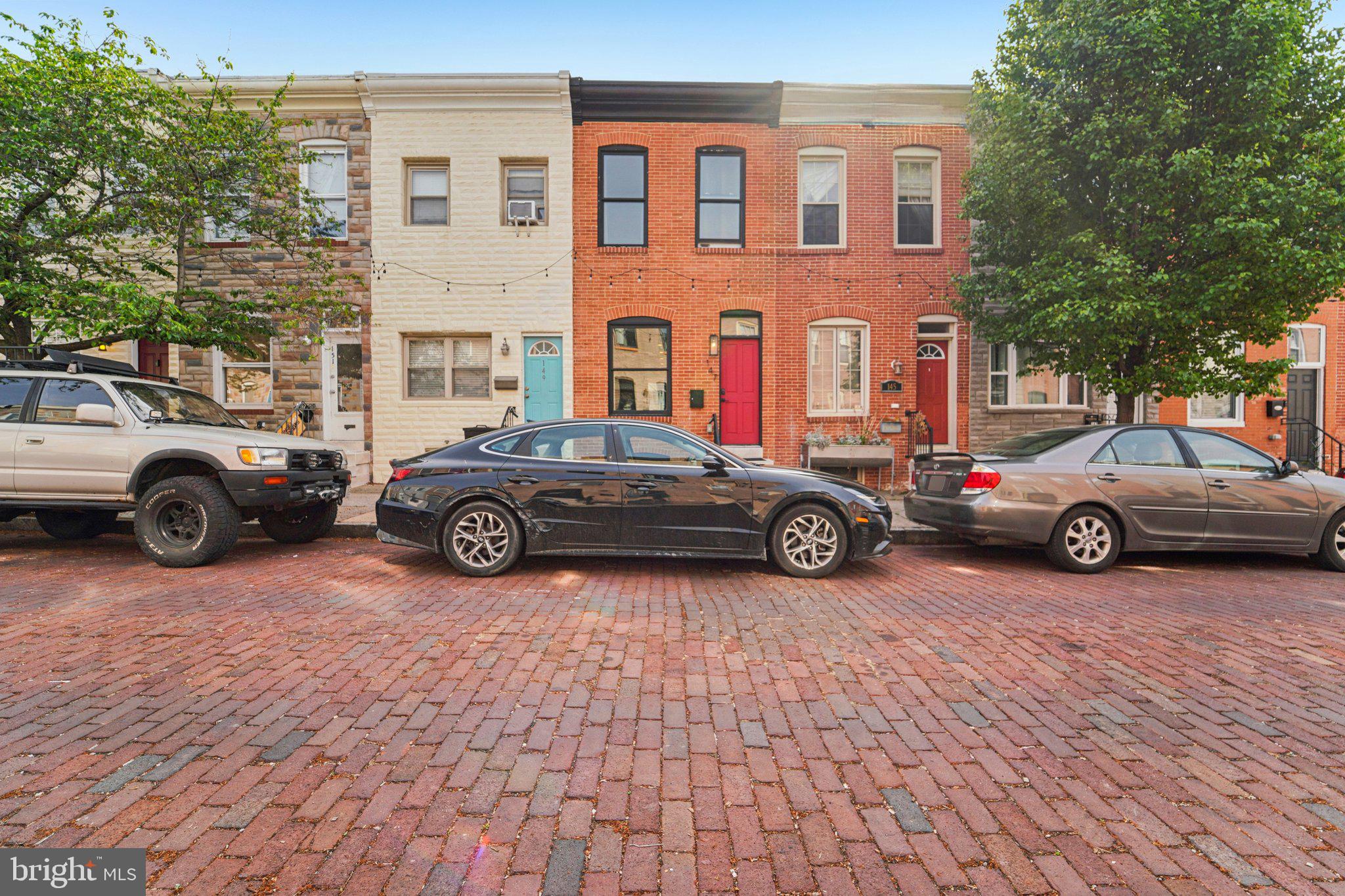 147 North Streeper Street Baltimore, MD 21224 - Photo 2 of 34 a car parked in front of a building