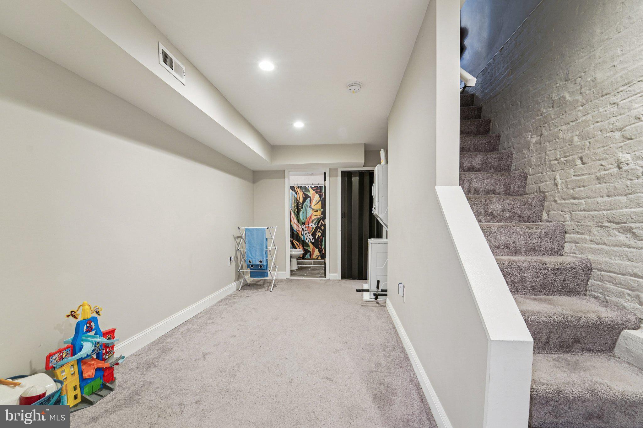 147 North Streeper Street Baltimore, MD 21224 - Photo 23 of 34 wooden floor with a staircase