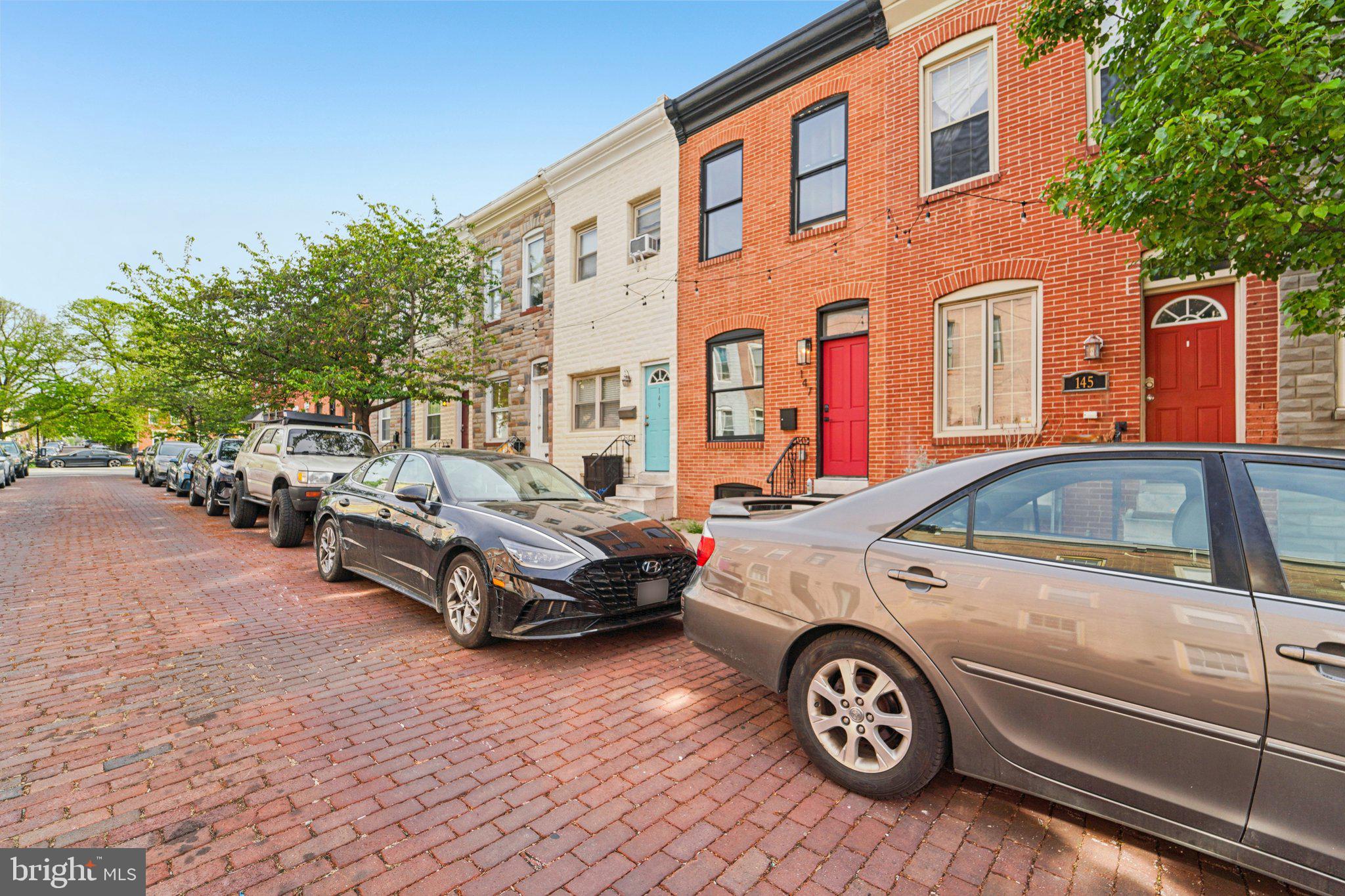 147 North Streeper Street Baltimore, MD 21224 - Photo 4 of 34 a front view of a house with parking space