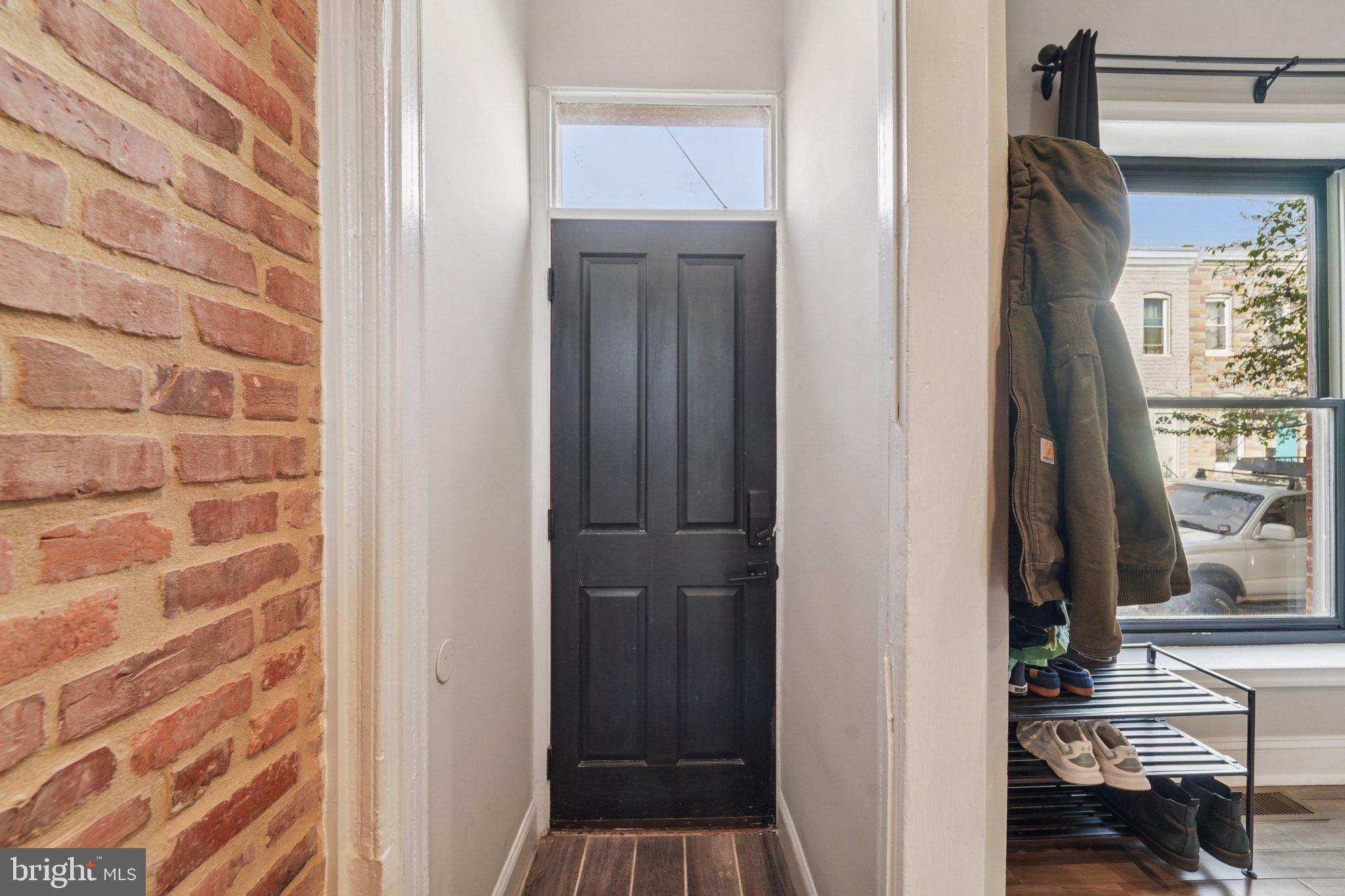 147 North Streeper Street Baltimore, MD 21224 - Photo 6 of 34 a view of a hallway with a door and a mirror