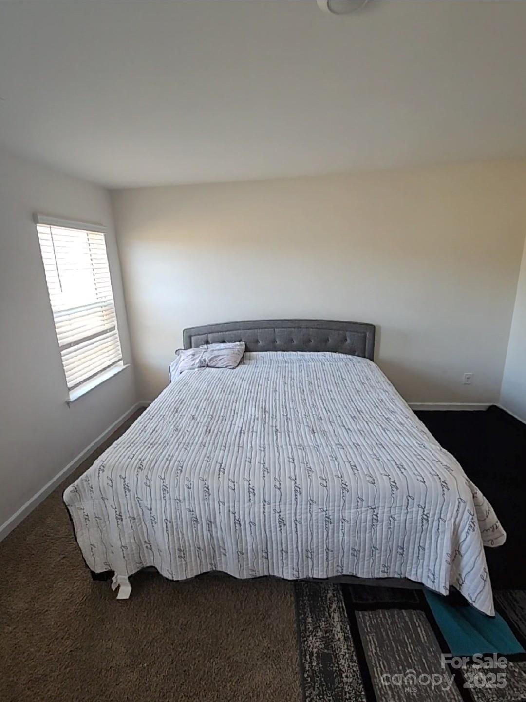324 Gaines Road Clover, SC 29710 - Photo 5 of 11 a bedroom with a bed and wooden floor