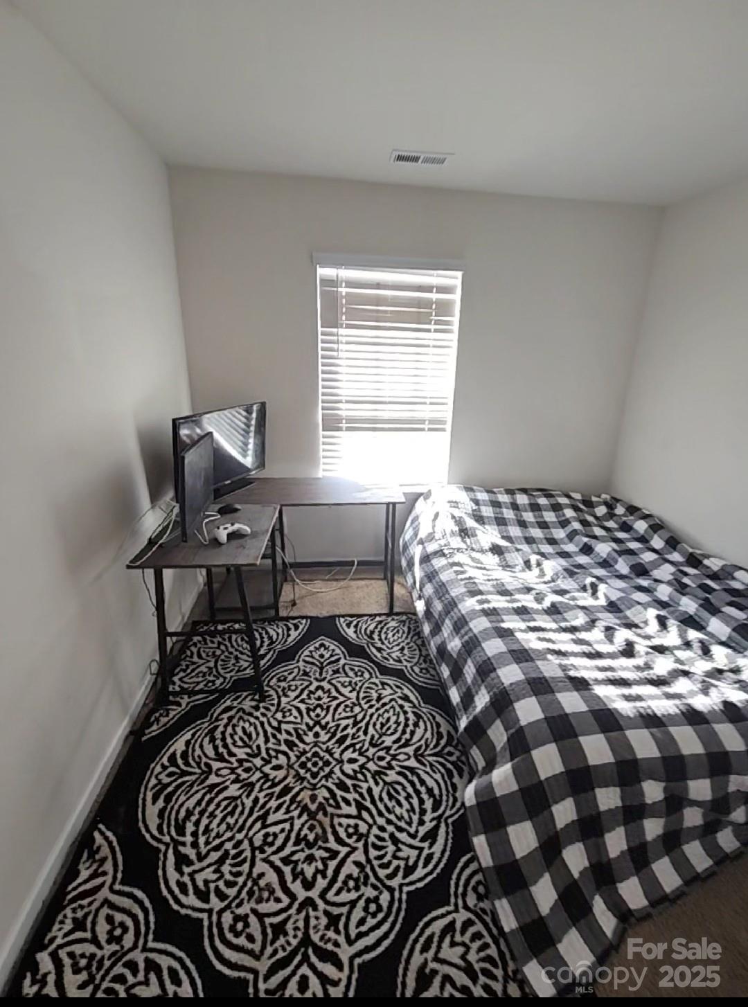 324 Gaines Road Clover, SC 29710 - Photo 7 of 11 a bedroom with a bed and a window