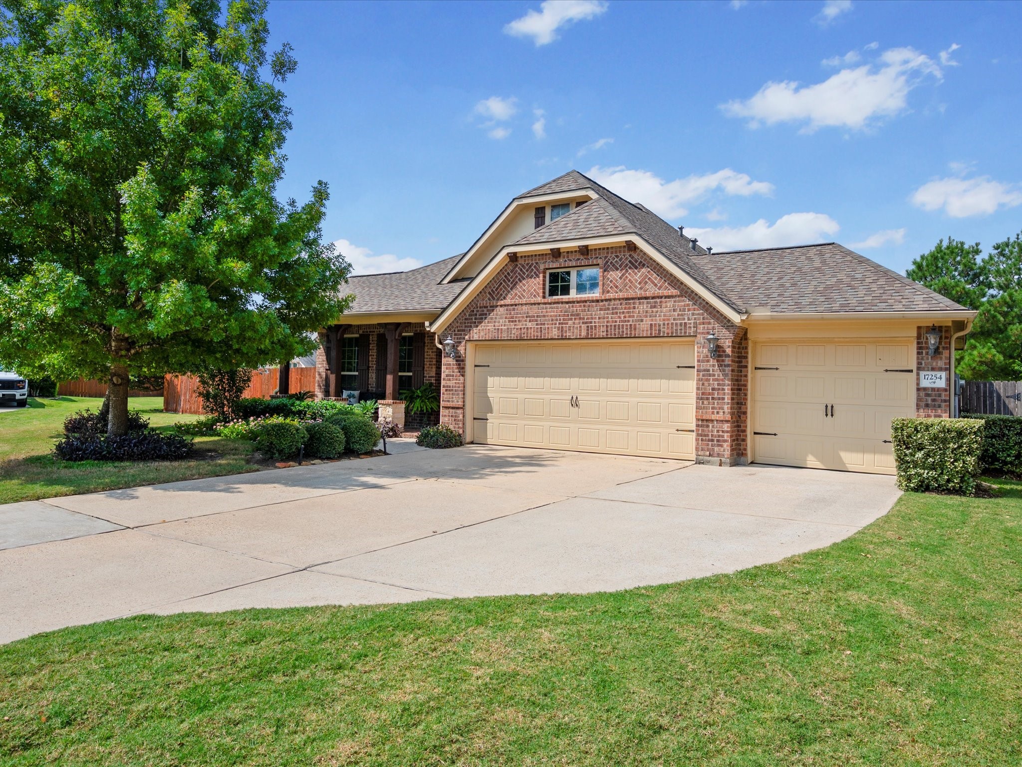 17254 Rookery Court Conroe, TX 77385 - Photo 1 of 36 a front view of a house with a yard and garage