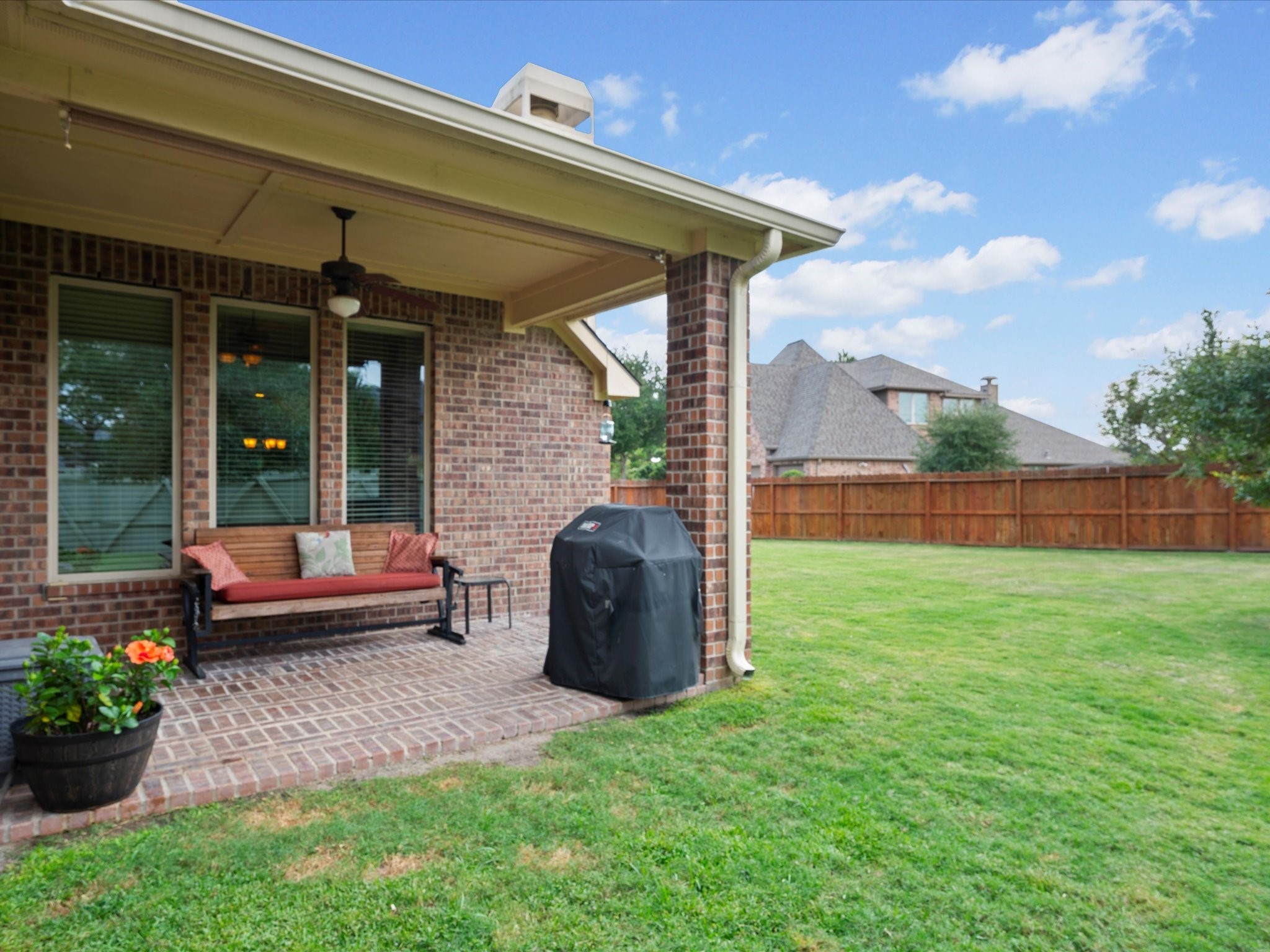 17254 Rookery Court Conroe, TX 77385 - Photo 24 of 36 a backyard of a house with a garden and outdoor seating