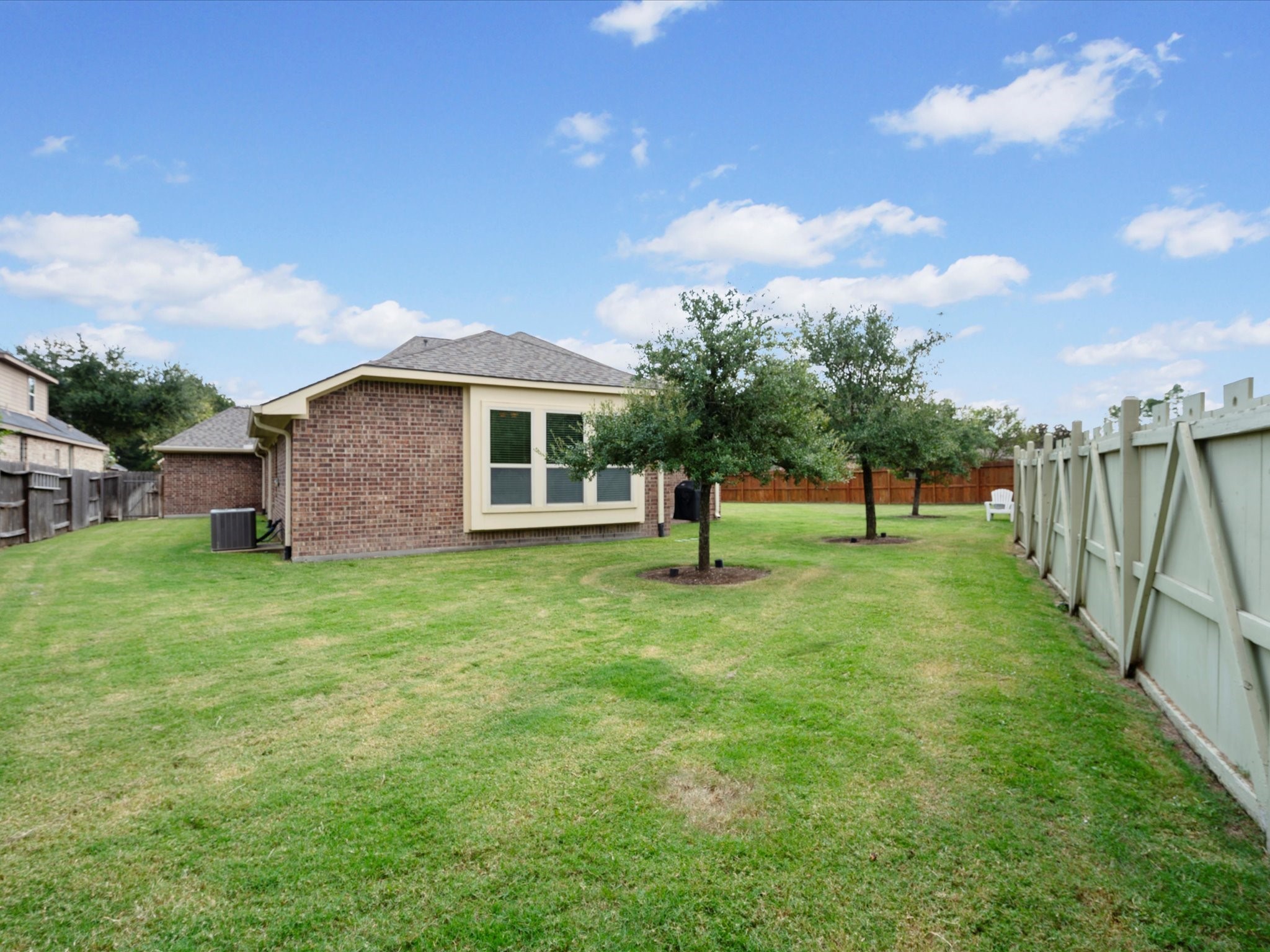 17254 Rookery Court Conroe, TX 77385 - Photo 26 of 36 a view of a house with a yard
