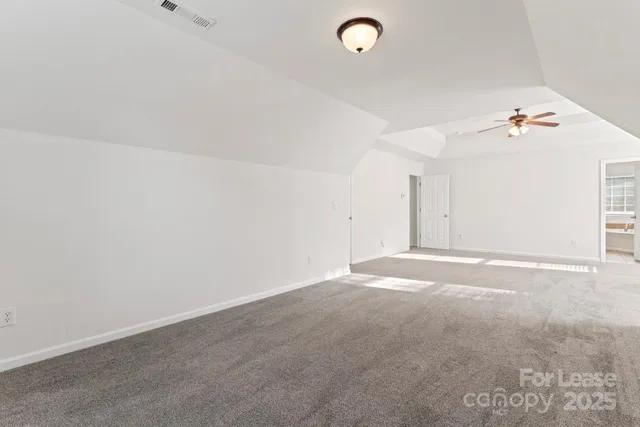 a bathroom with a tub a sink double vanity granite and a mirror