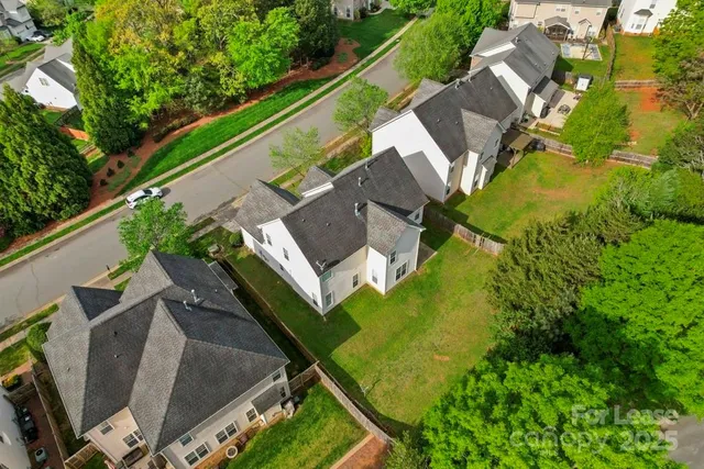 an aerial view of a house with a garden