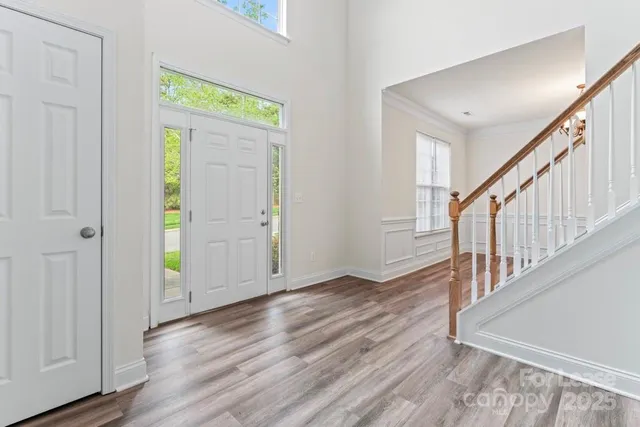 a view of an entryway with wooden floor