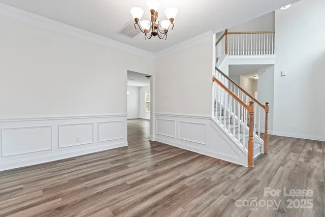 a view of an entryway with wooden floor