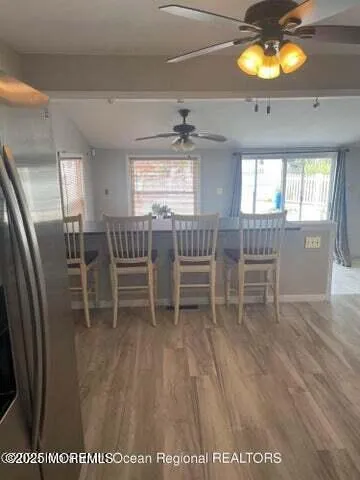a dining room with furniture and window