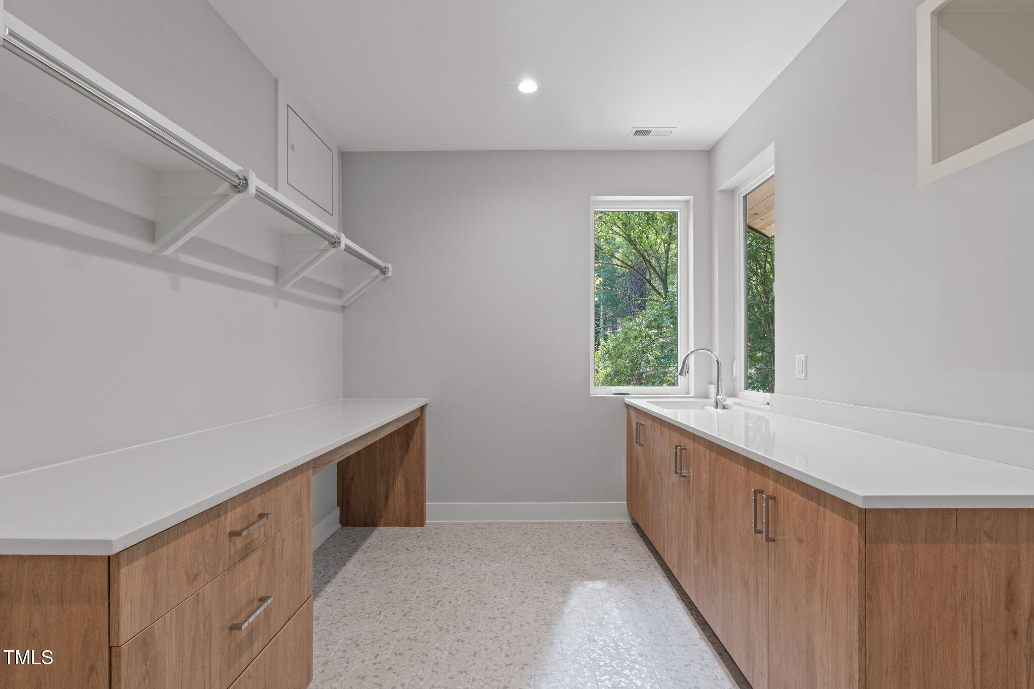 1435 Duplin Road Raleigh, NC 27607 - Photo 37 of 69 a spacious bathroom with a sink and a window