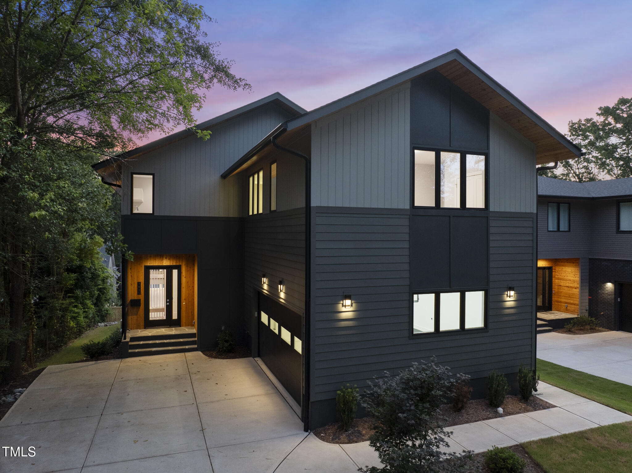 1435 Duplin Road Raleigh, NC 27607 - Photo 4 of 69 a front view of a house with a yard