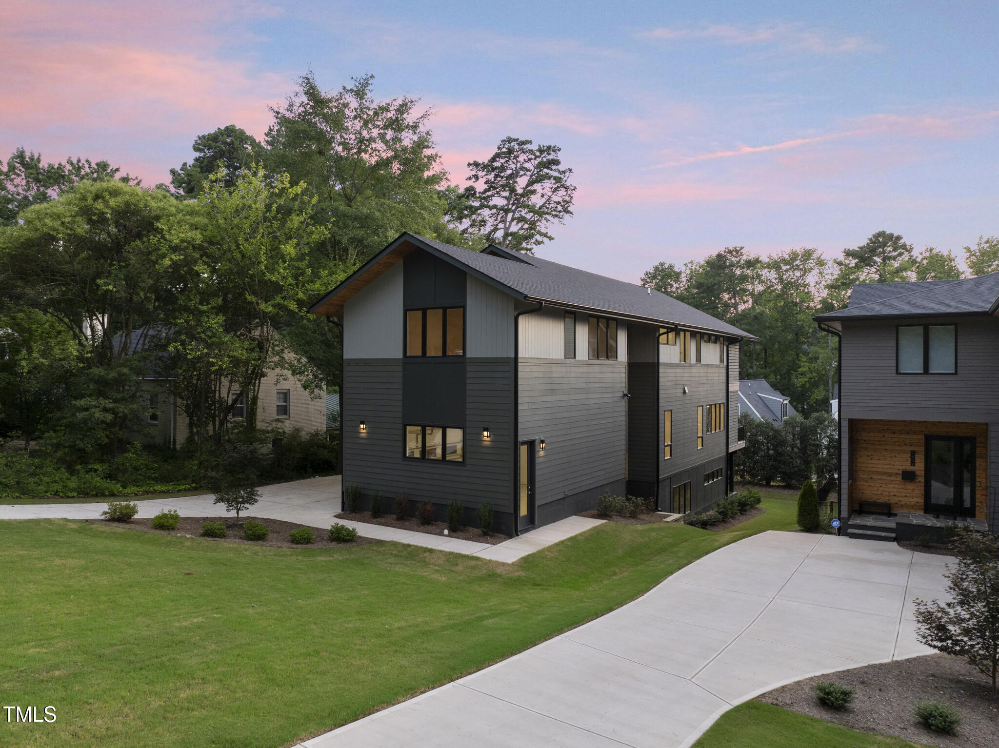 1435 Duplin Road Raleigh, NC 27607 - Photo 54 of 69 a front view of a house with a garden