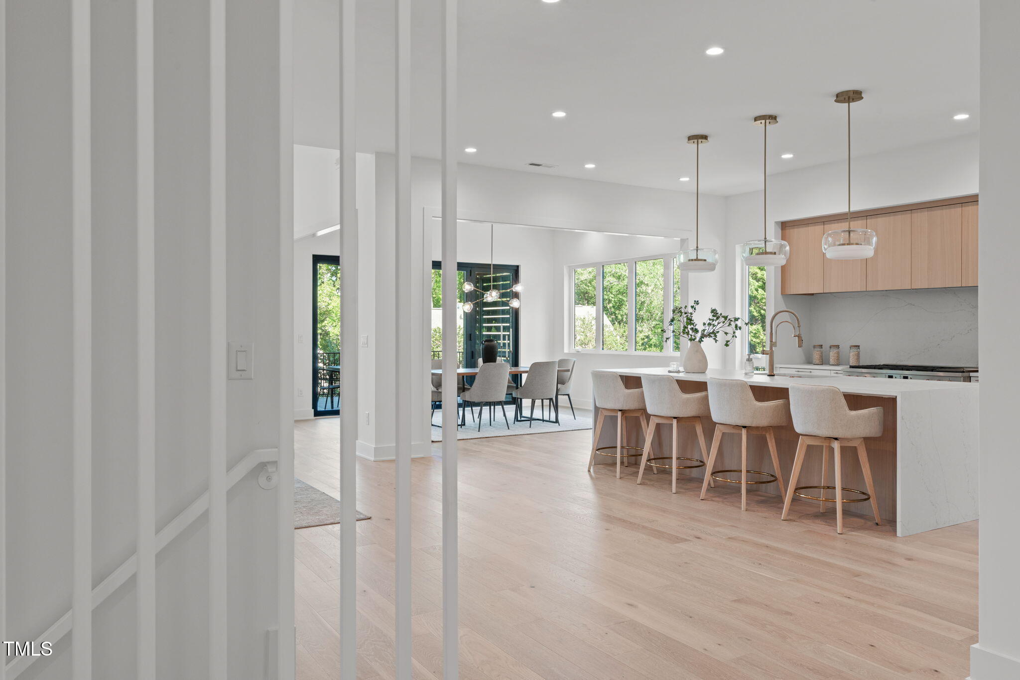 1435 Duplin Road Raleigh, NC 27607 - Photo 7 of 69 a dining room with furniture a rug and a chandelier