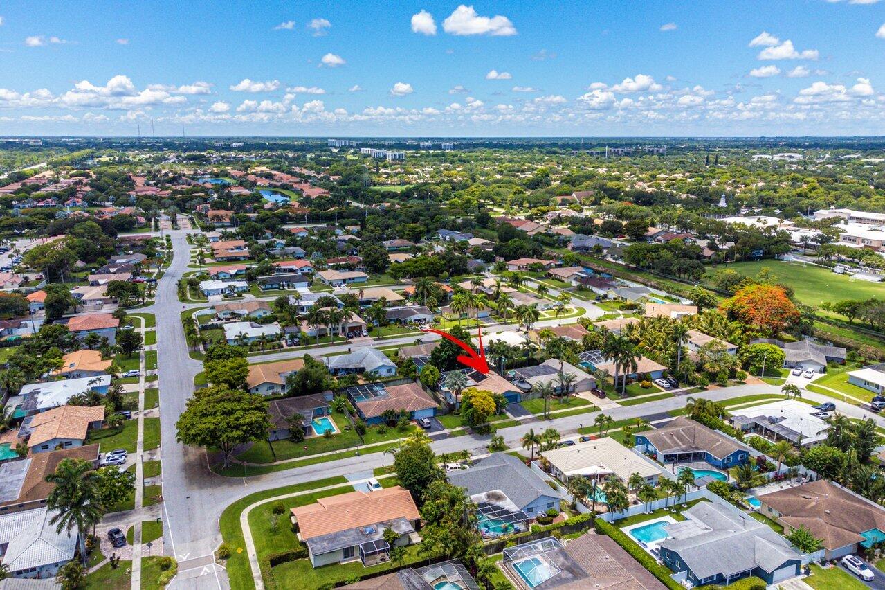 105 Orchard Ridge Lane Boca Raton, FL 33431 - Photo 36 of 37 an aerial view of residential houses with outdoor space and swimming pool