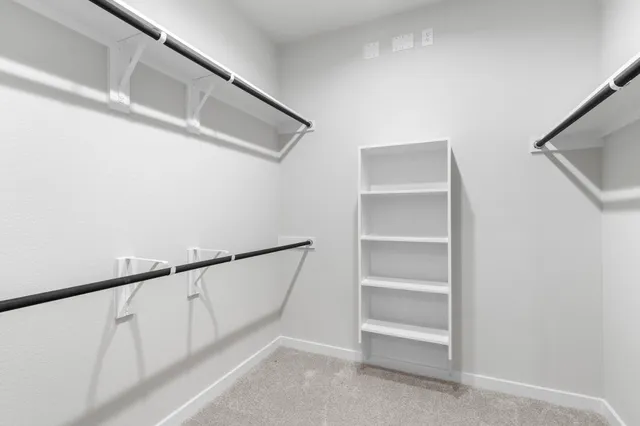 a view of an empty walk in closet