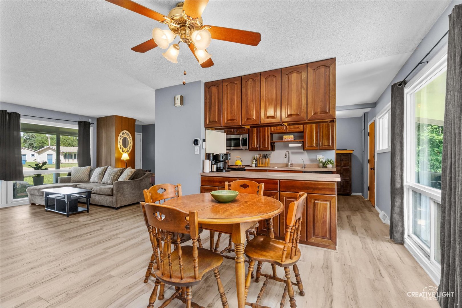 4 Woodcliff Road Montgomery, IL 60538 - Photo 4 of 18 a dining room with furniture a chandelier and wooden floor