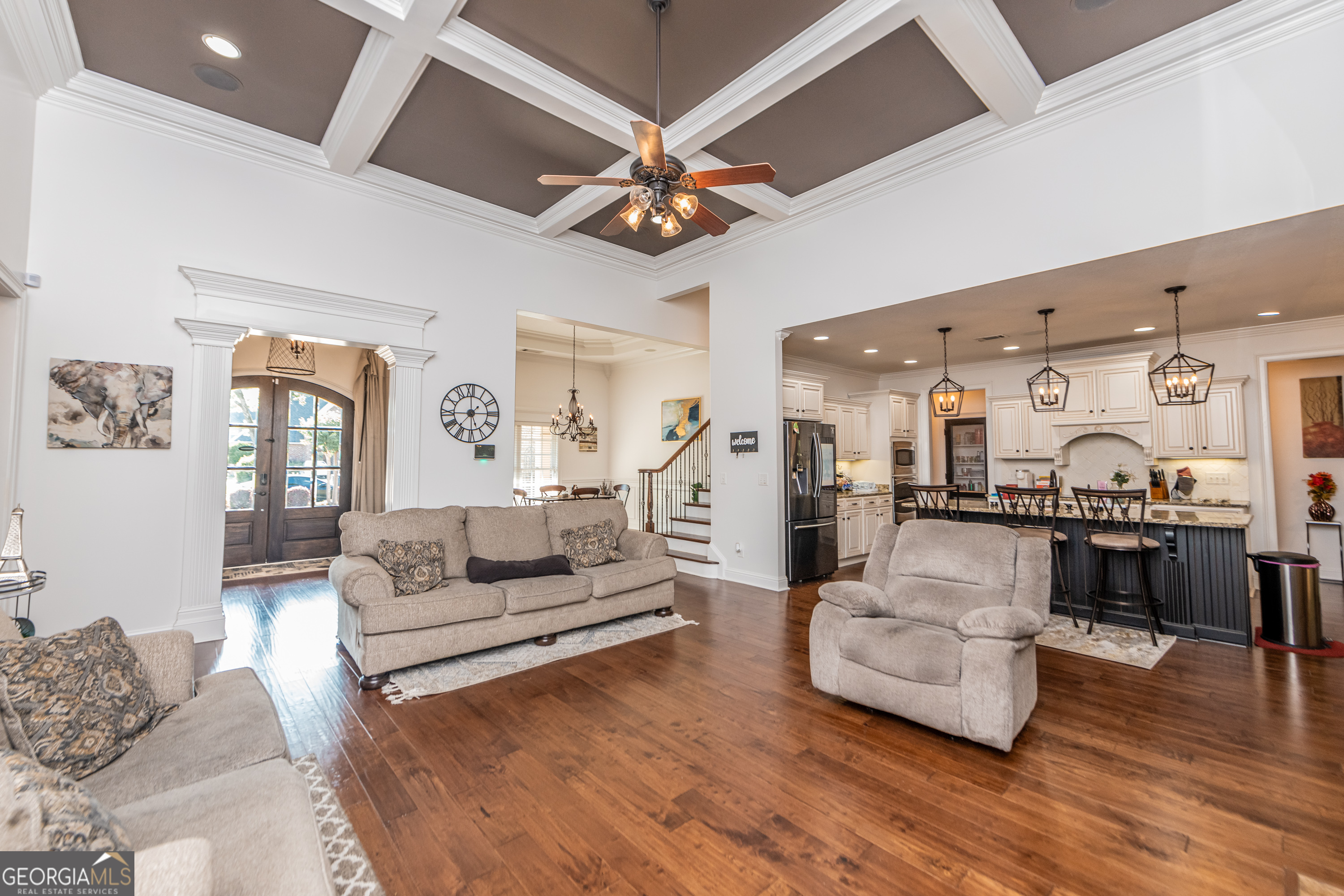 405 Old Bridge Road Warner Robins, GA 31088 - Photo 12 of 55 a living room with furniture kitchen view and a chandelier