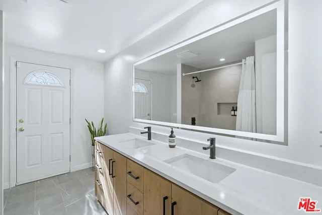 a bathroom with a tub and a toilet