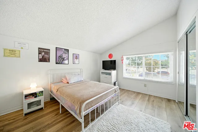 a room with furniture a couch and a bookshelf