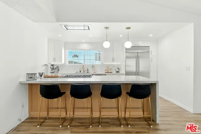 a view of a kitchen from the hallway