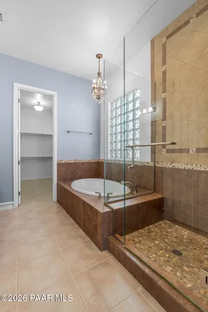 a bathroom with a tub and shower